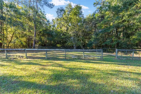 a kitchen with a sink a refrigerator and window
