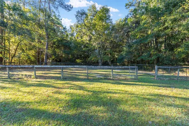 a kitchen with a sink a refrigerator and window