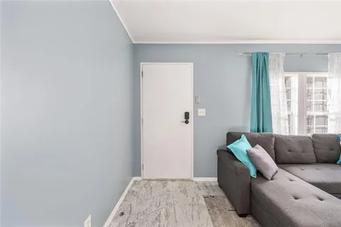 a bedroom with a bed and a ceiling fan