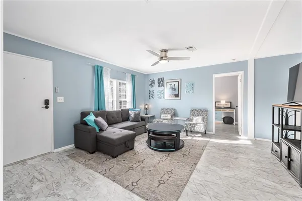 a bathroom with a toilet a sink and a mirror