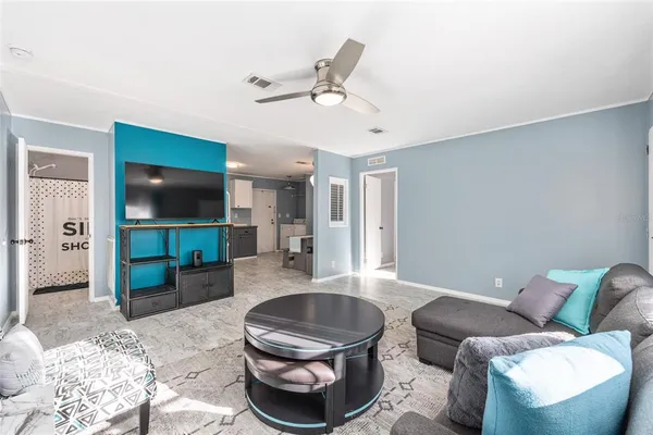 a swimming pool with outdoor seating and yard