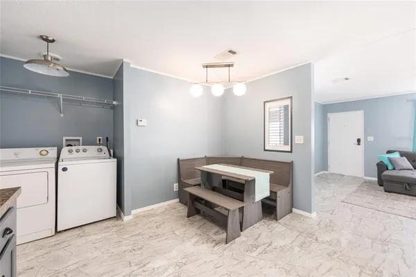 a view of a swimming pool with a yard and large trees