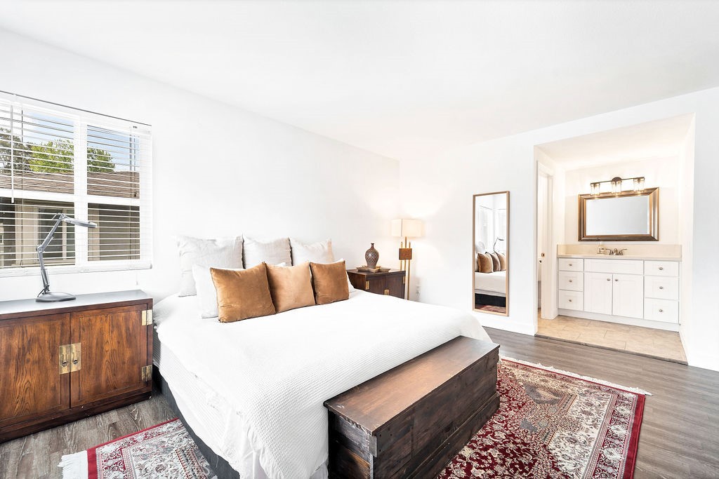 4267 Arcata Bay Way Oceanside, CA 92058 - Photo 11 of 34 a bedroom with a large bed and a couch