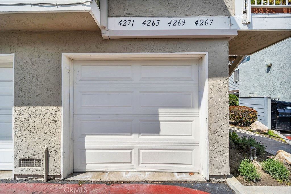 4267 Arcata Bay Way Oceanside, CA 92058 - Photo 31 of 34 a front view of a building with entryway