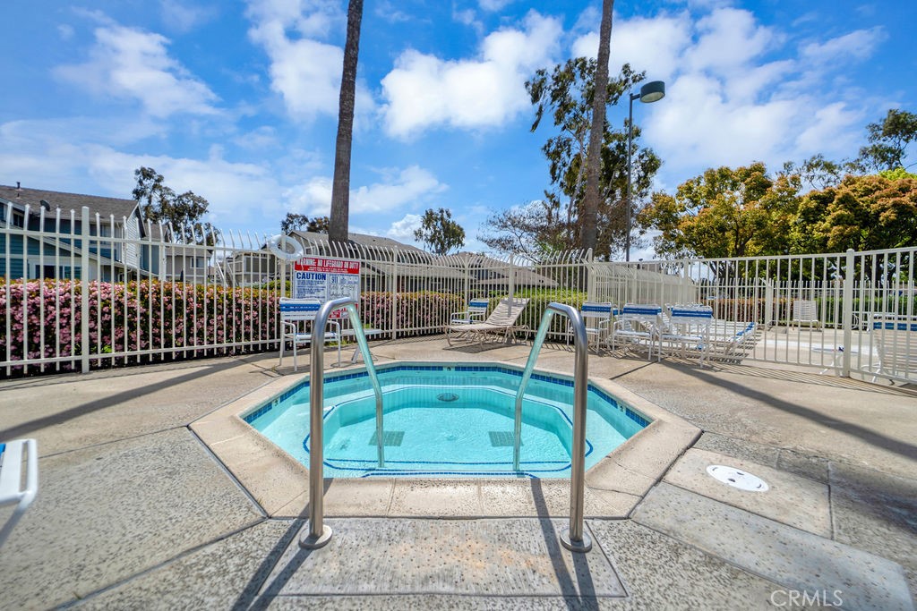 4267 Arcata Bay Way Oceanside, CA 92058 - Photo 33 of 34 a view of a swimming pool with a lounge chairs