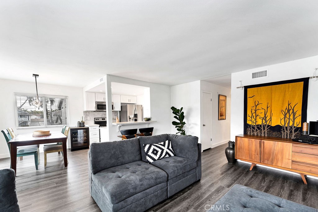 4267 Arcata Bay Way Oceanside, CA 92058 - Photo 4 of 34 a living room with furniture and a large window