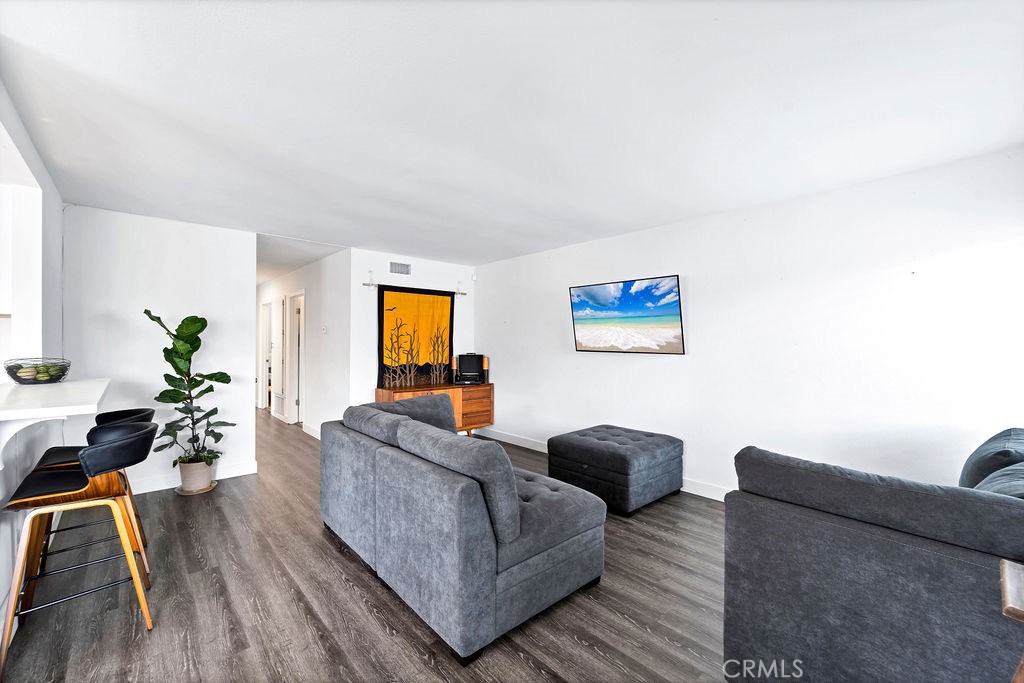4267 Arcata Bay Way Oceanside, CA 92058 - Photo 5 of 34 a living room with furniture and wooden floor