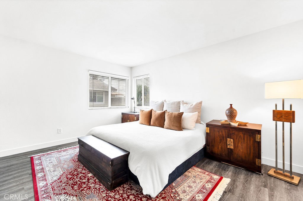 4267 Arcata Bay Way Oceanside, CA 92058 - Photo 10 of 34 a bedroom with a bed and wooden floor