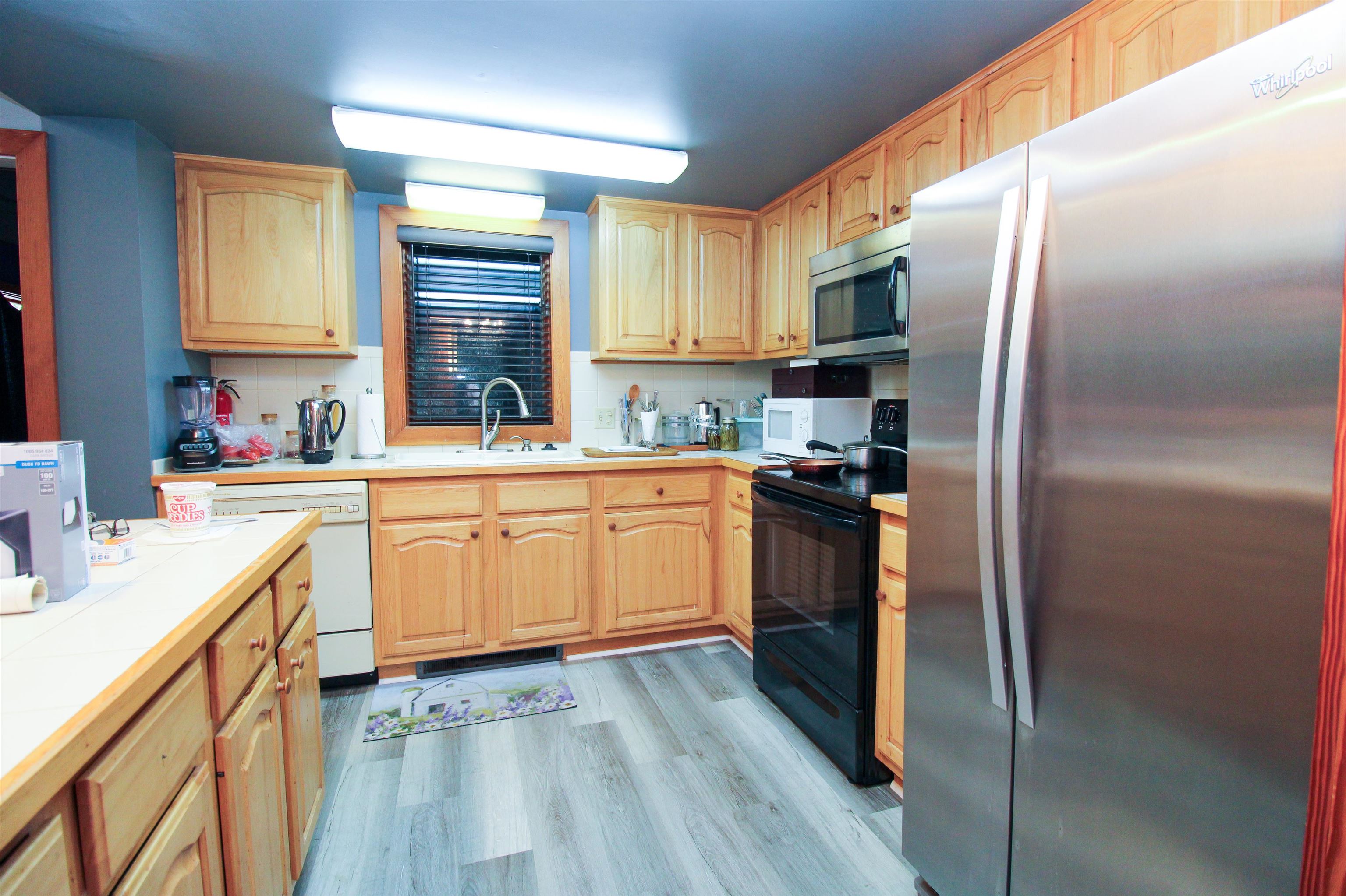 781 Devils Knob Loop Roseland, VA 22967 - Photo 25 of 68 a kitchen with a sink stove and refrigerator