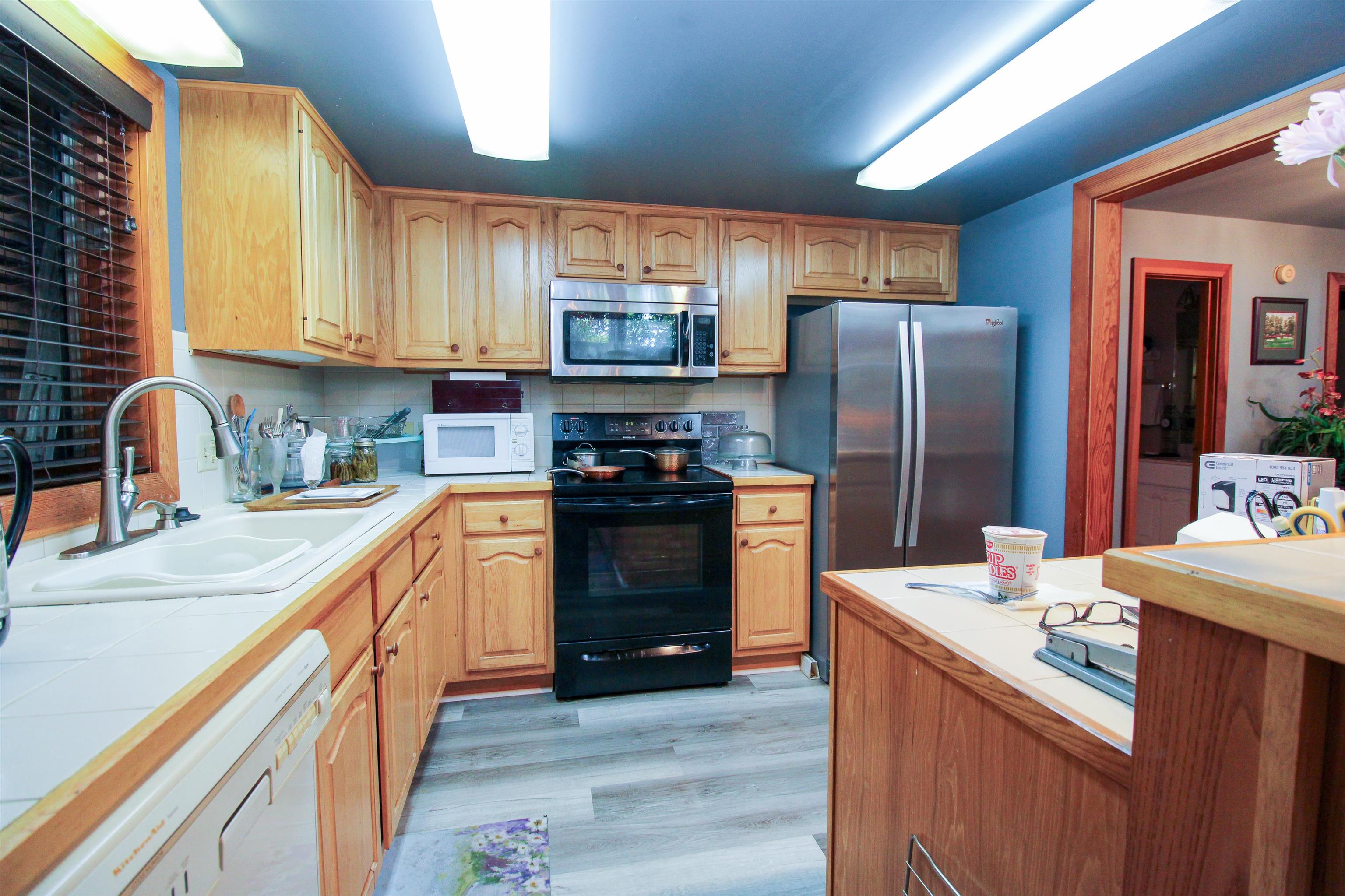 781 Devils Knob Loop Roseland, VA 22967 - Photo 29 of 68 a kitchen with stainless steel appliances a refrigerator sink and cabinets