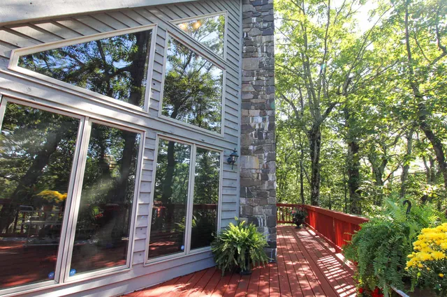 a view of a balcony with flower plants