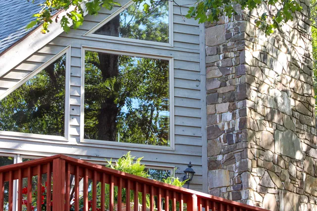 a view of a balcony with a tree