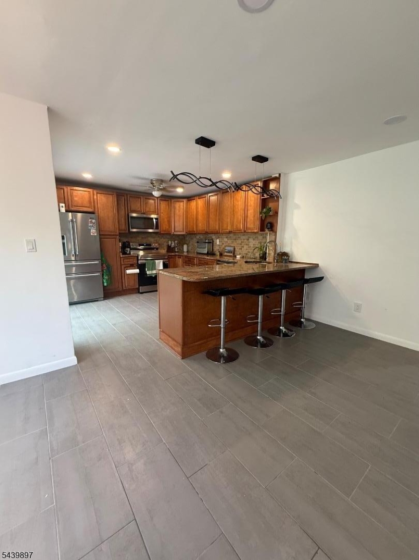 22 Karen Road Vernon, NJ 07422 - Photo 10 of 26 a room with furniture and a flat screen tv