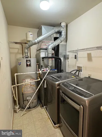 a utility room with washer and dryer