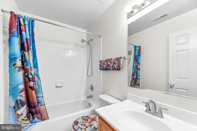 a bathroom with a sink a bath tub and a shower