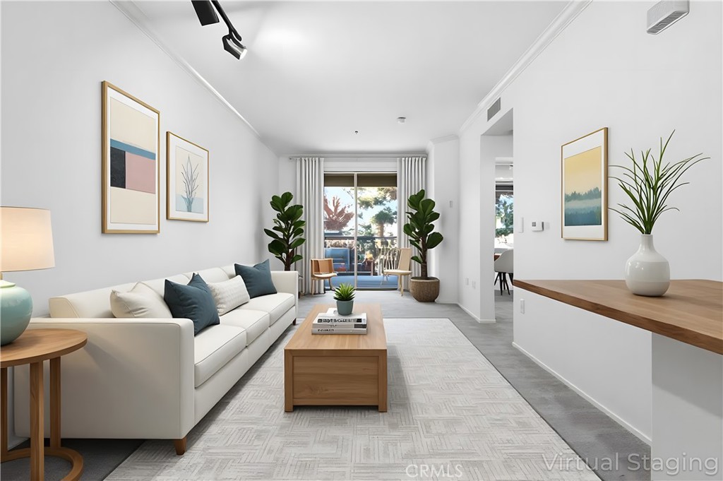 2311 Watermarke Place Irvine, CA 92612 - Photo 11 of 33 a living room with furniture and a potted plant