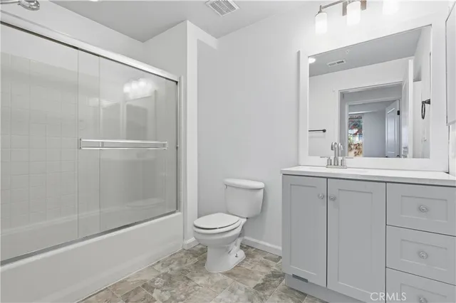 a bathroom with a shower and a toilet