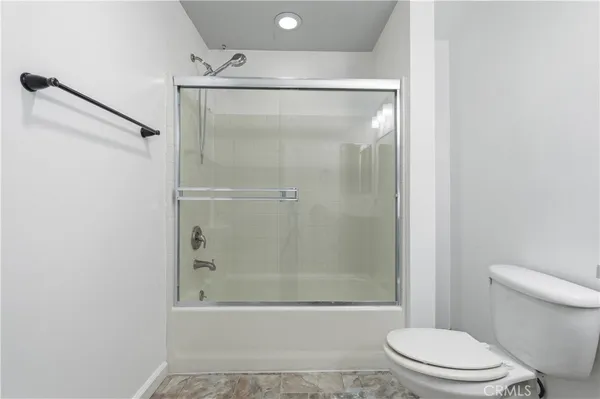 a view of storage and utility room with closet