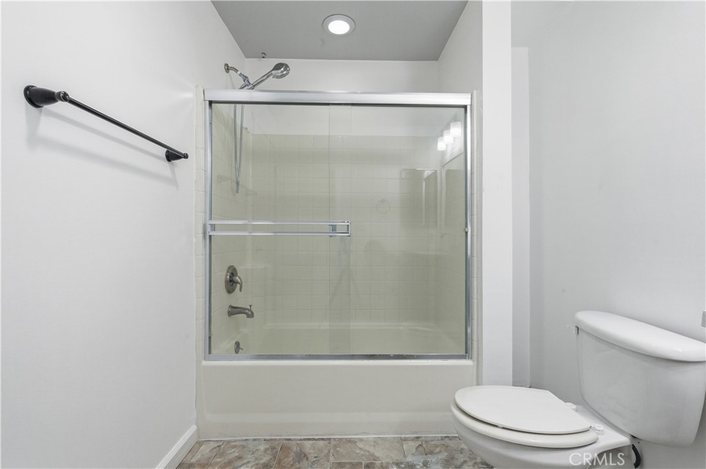2311 Watermarke Place Irvine, CA 92612 - Photo 20 of 33 a bathroom with a shower and a toilet