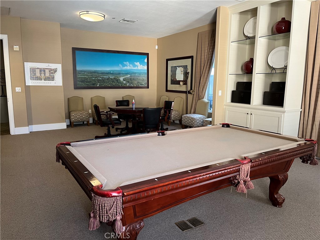 2311 Watermarke Place Irvine, CA 92612 - Photo 27 of 33 a living room with furniture pool table and flat screen tv