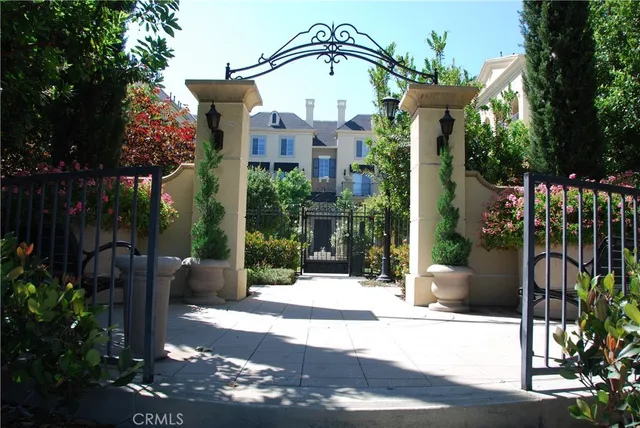 a view of patio with a table and chairs under an umbrella