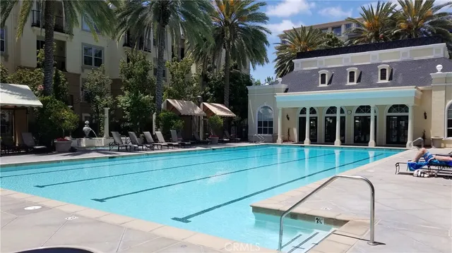 a view of house with outdoor space and swimming pool