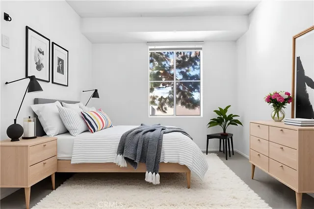 a kitchen with stainless steel appliances granite countertop a refrigerator a stove and a sink with wooden cabinets