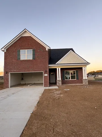 a front view of a house with yard