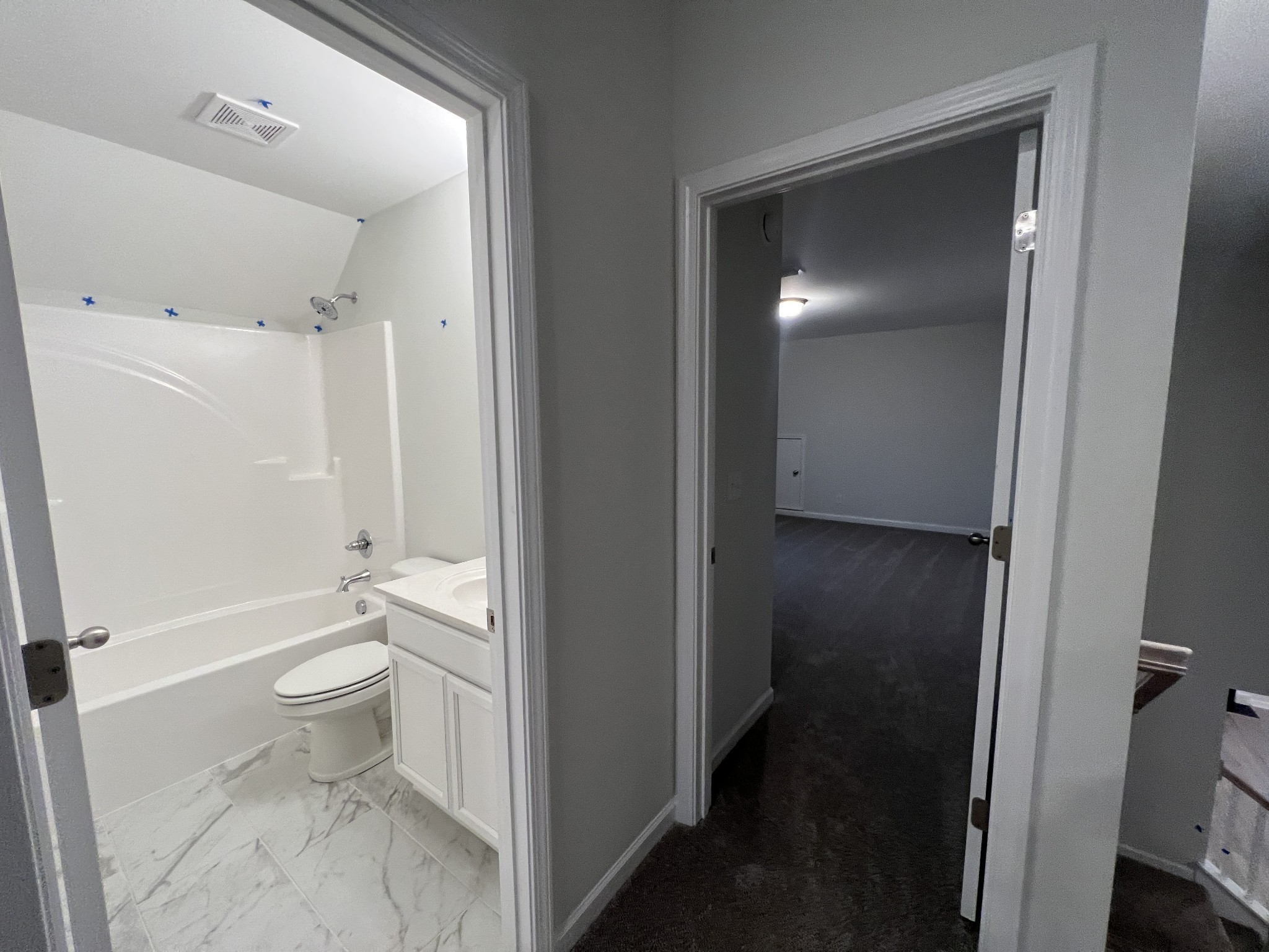 5620 Rooker Road Smyrna, TN 37167 - Photo 16 of 17 a bathroom with a granite countertop toilet a sink and a mirror