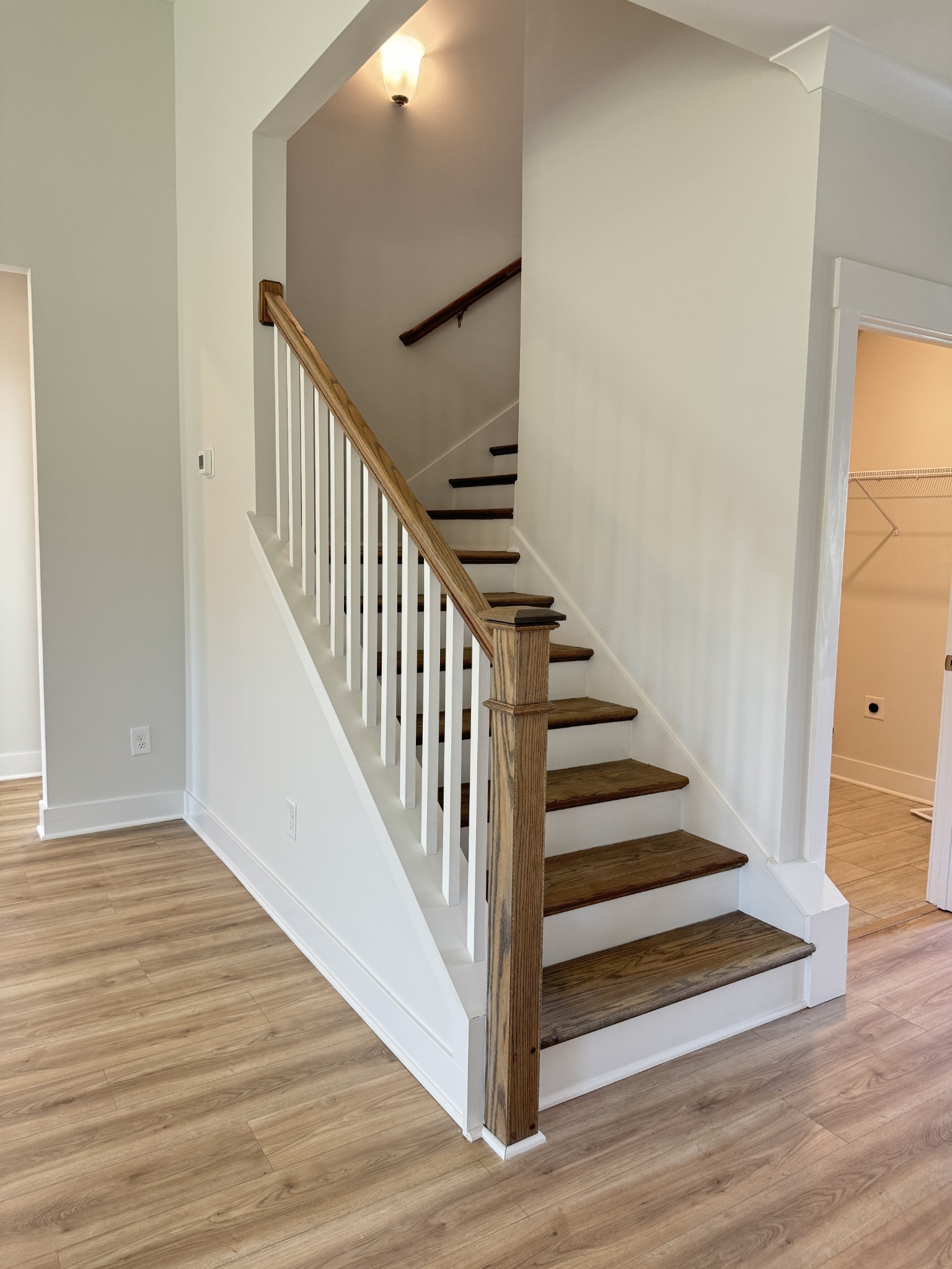 5620 Rooker Road Smyrna, TN 37167 - Photo 6 of 17 a view of a hallway with wooden floor and entryway