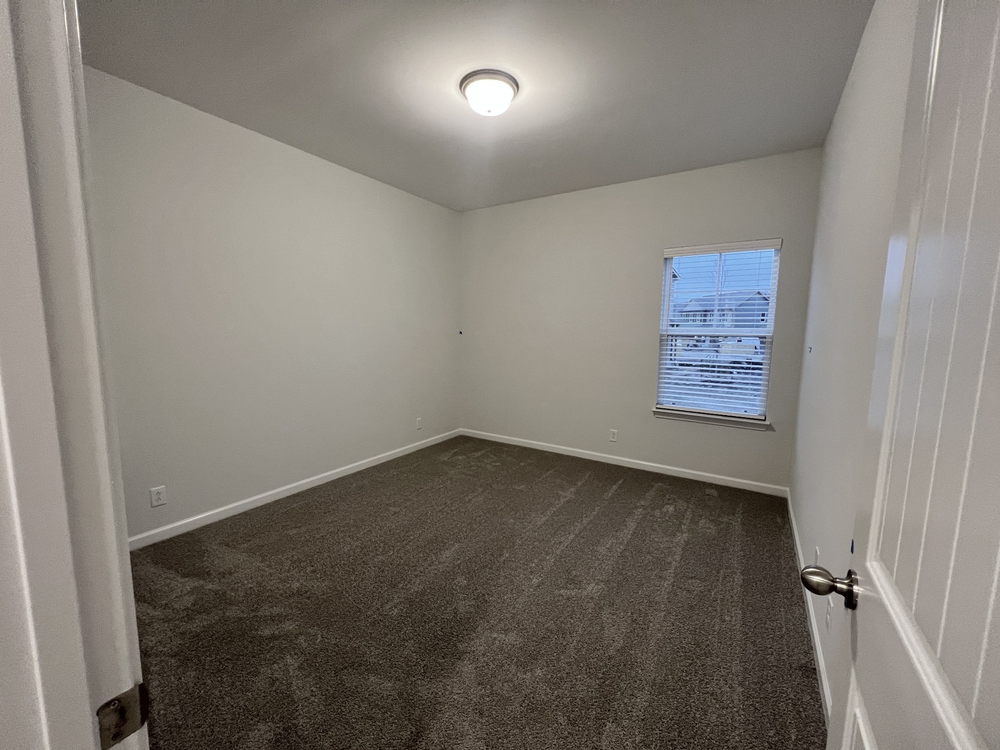 5620 Rooker Road Smyrna, TN 37167 - Photo 10 of 17 an empty room with a empty space and windows