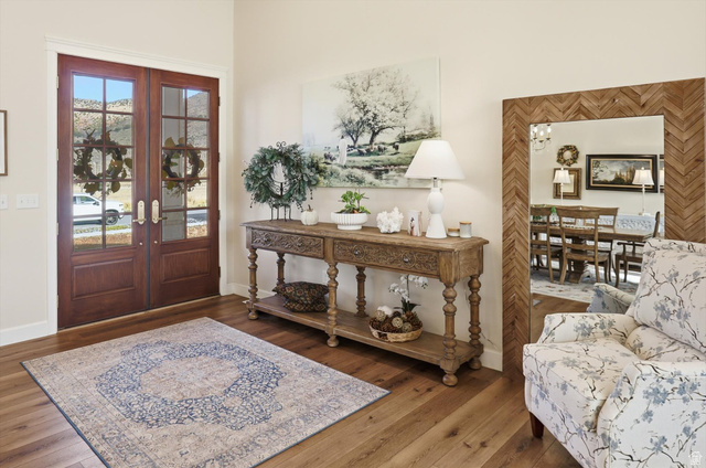 534 East Fish Hatchery Road Mantua, UT 84324 - Photo 2 of 87 Entryway featuring french doors, wood-type flooring, and suspended lighting