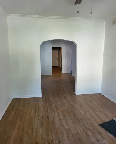 a view of a livingroom with wooden floor