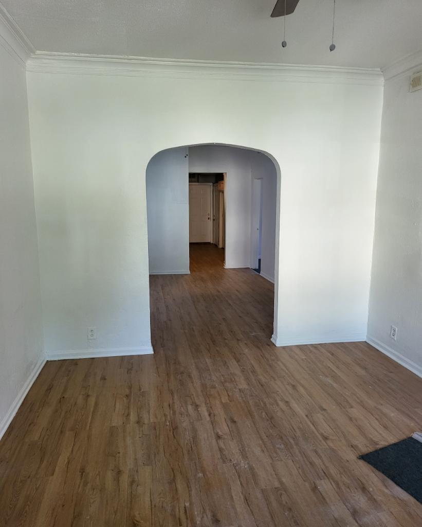 a view of a livingroom with wooden floor