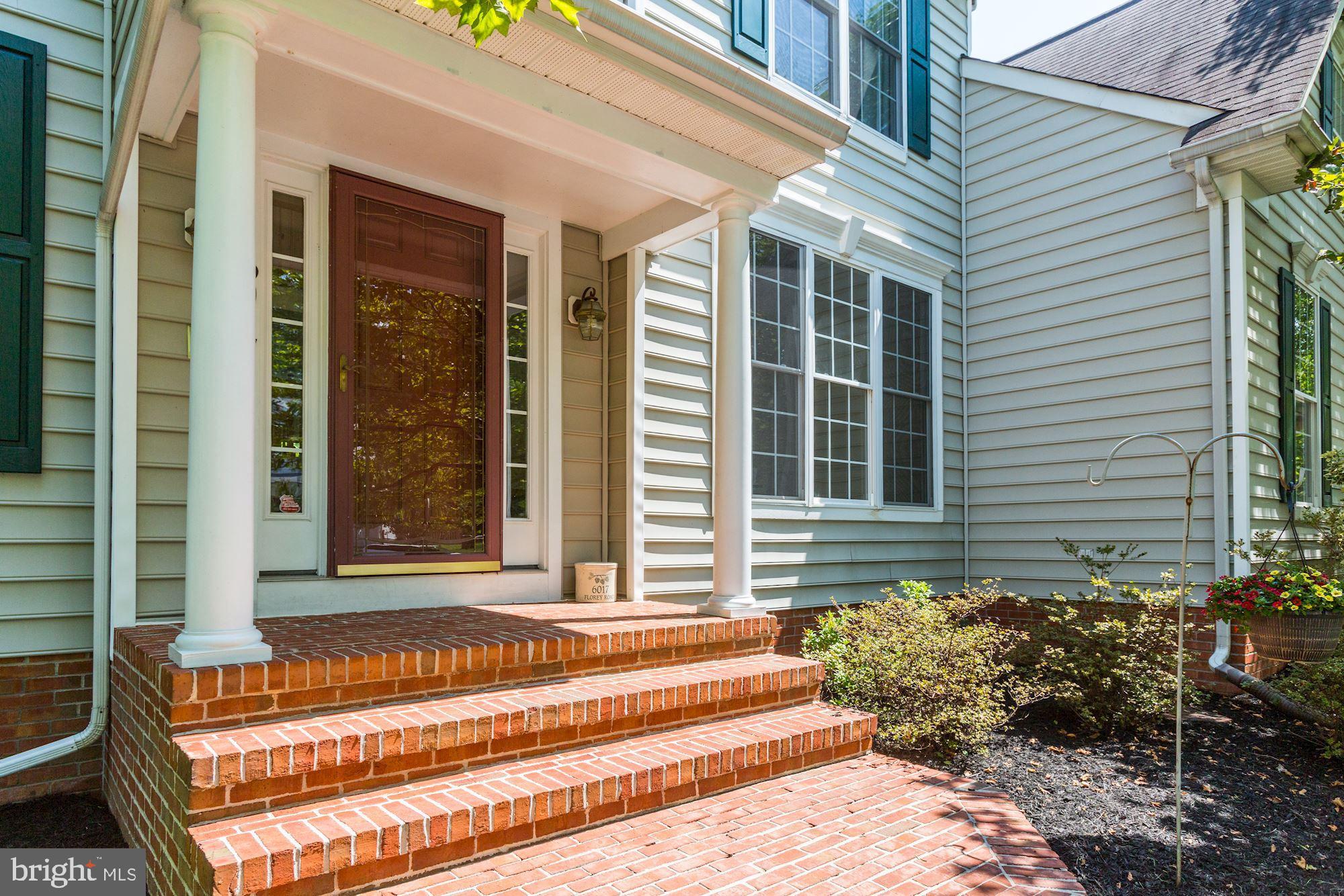 6017 Florey Road Hanover, MD 21076 - Photo 4 of 46 Front Portico with brick sidewalk