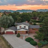 an aerial view of a house with big yard