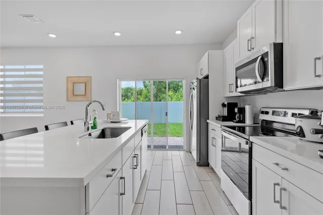a large kitchen with cabinets
