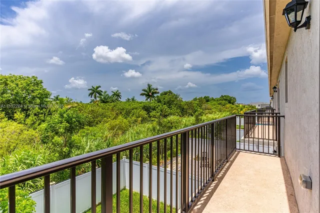 a view of a balcony with an outdoor space