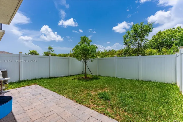 a aerial view of a town with large trees