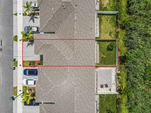 an aerial view of a house with a garden