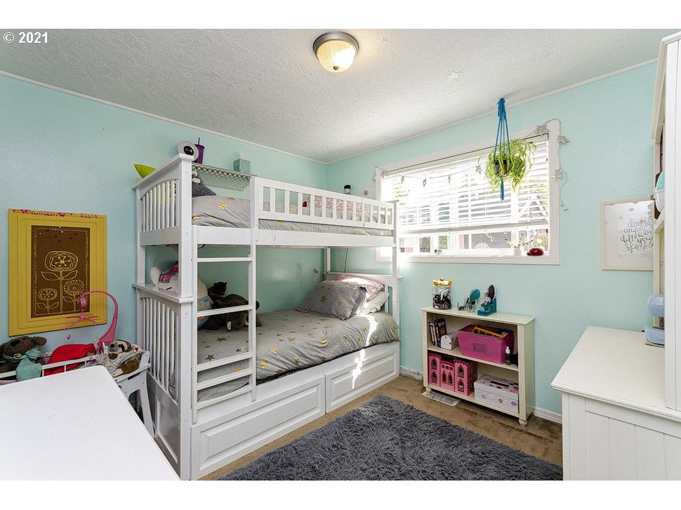 290 Southeast Palmblad Drive Gresham, OR 97080 - Photo 18 of 32 a bedroom with furniture and a window