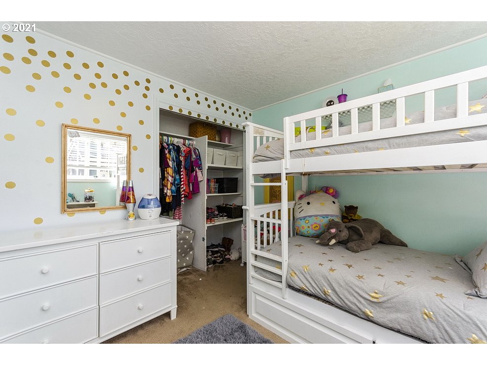 290 Southeast Palmblad Drive Gresham, OR 97080 - Photo 19 of 32 a bedroom with a bed and a window