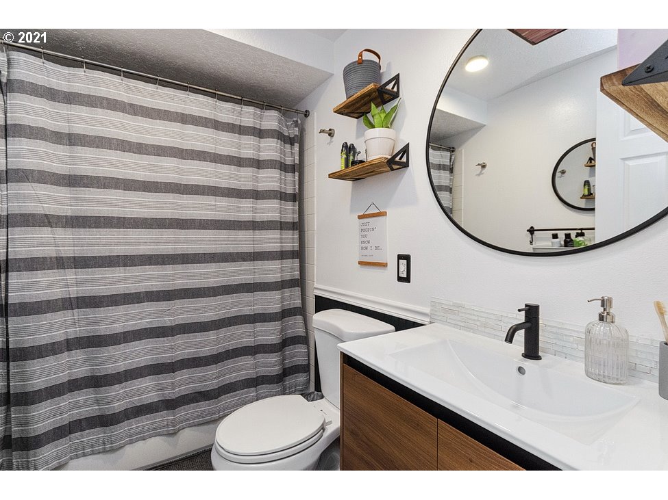 290 Southeast Palmblad Drive Gresham, OR 97080 - Photo 22 of 32 a bathroom with a sink mirror and toilet