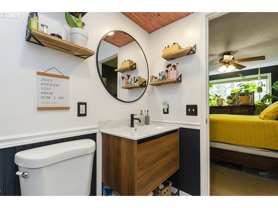 290 Southeast Palmblad Drive Gresham, OR 97080 - Photo 23 of 32 a bathroom with a sink a mirror and a toilet