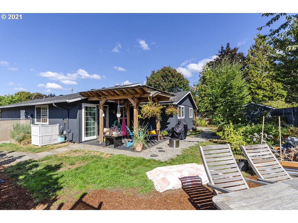 290 Southeast Palmblad Drive Gresham, OR 97080 - Photo 28 of 32 a view of a chairs and tables in the back yard of the house