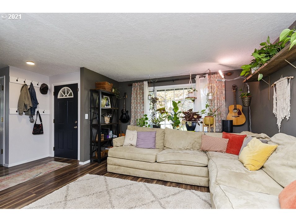 290 Southeast Palmblad Drive Gresham, OR 97080 - Photo 5 of 32 a living room with furniture and a large window