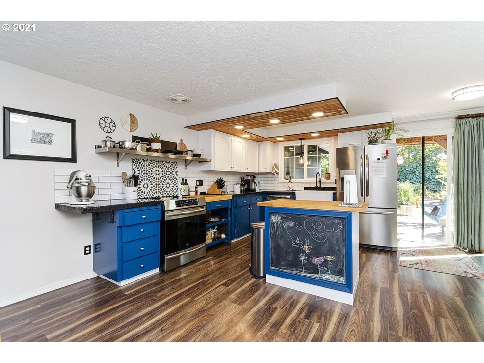 290 Southeast Palmblad Drive Gresham, OR 97080 - Photo 7 of 32 a room with wooden floors and furniture