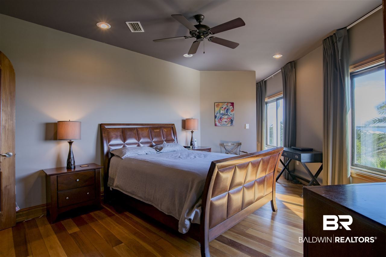 32537 River Road Orange Beach, AL 36561 - Photo 26 of 46 Level 3 Mahogany Flooring South Side of Home