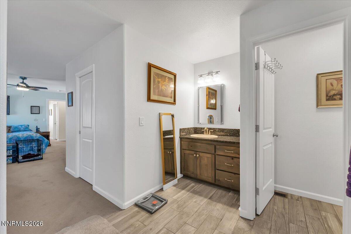 1197 Sky Ridge Drive Fallon, NV 89406 - Photo 23 of 79 a view of a kitchen with an entryway and wooden floor
