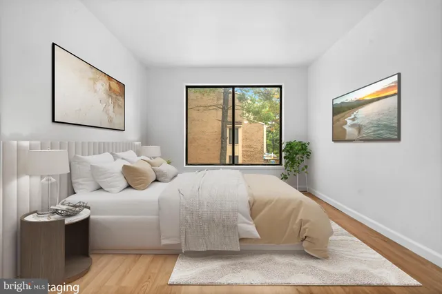 a bedroom with a large bed and a window